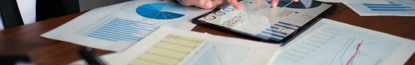 documents on a table with two people reviewing